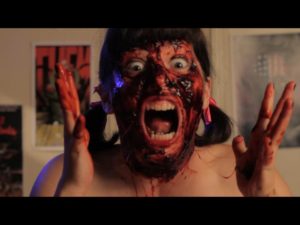 Emily Milling - Producer, Composer for Impossible Horror - Emily is covered in fake blood and screaming.